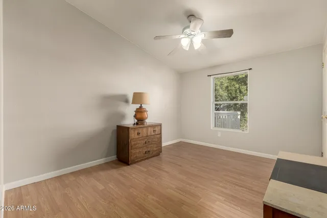 a view of workspace with furniture and chandelier