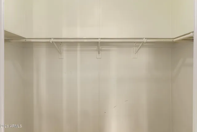 a view of a room with shelf on the wall