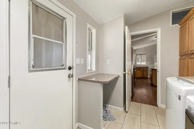 a view of a kitchen from the hallway