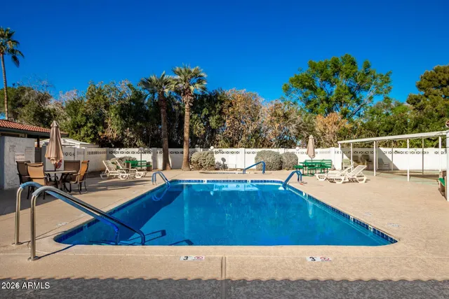 a view of a swimming pool with a lounge chair