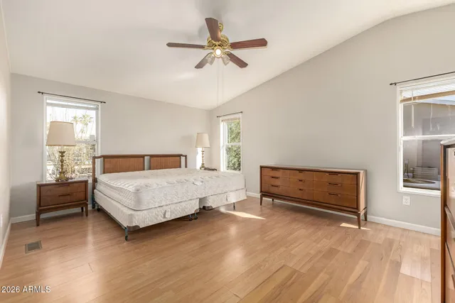 a bedroom with a bed and a dresser