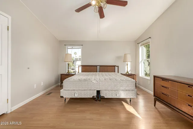 a bedroom with a bed and window