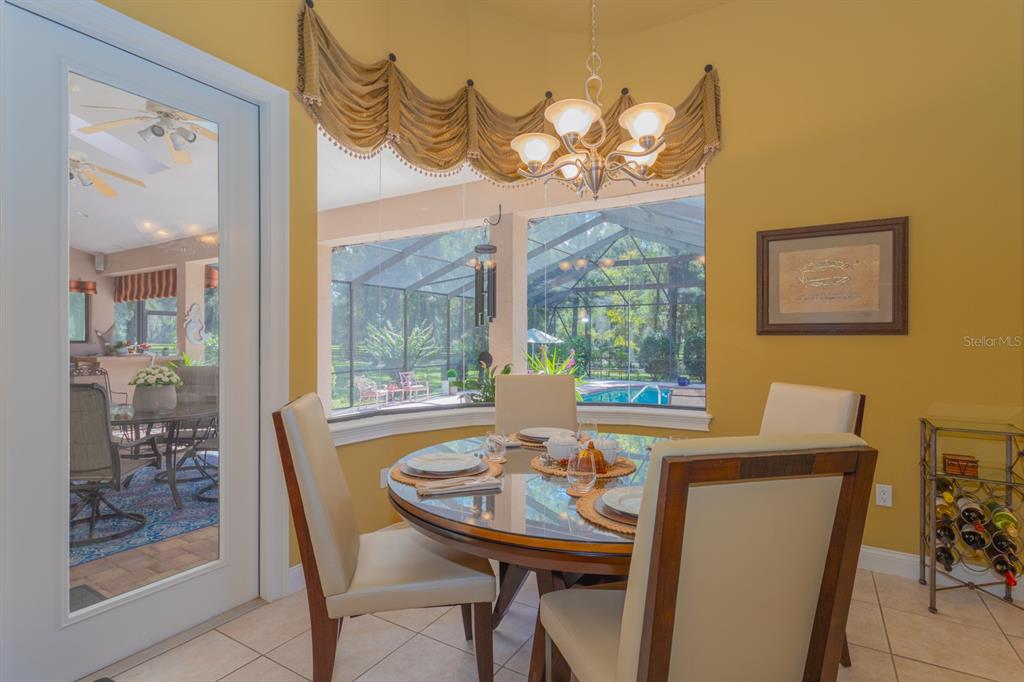 1640 Southeast 91st Place Ocala, FL 34480 - Photo 31 of 66 a view of a dining room with furniture window and outside view
