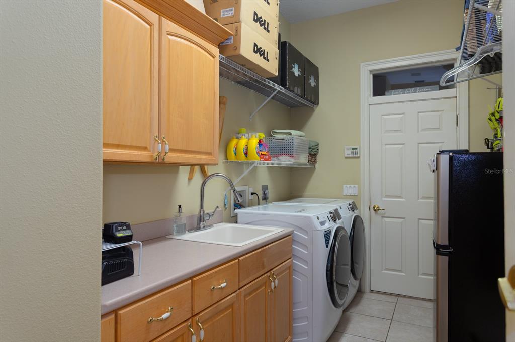 1640 Southeast 91st Place Ocala, FL 34480 - Photo 35 of 66 a utility room with dryer and washer