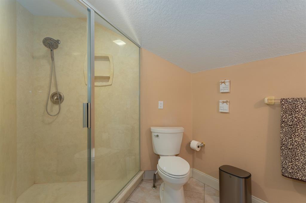 1640 Southeast 91st Place Ocala, FL 34480 - Photo 42 of 66 a bathroom with a toilet and a shower