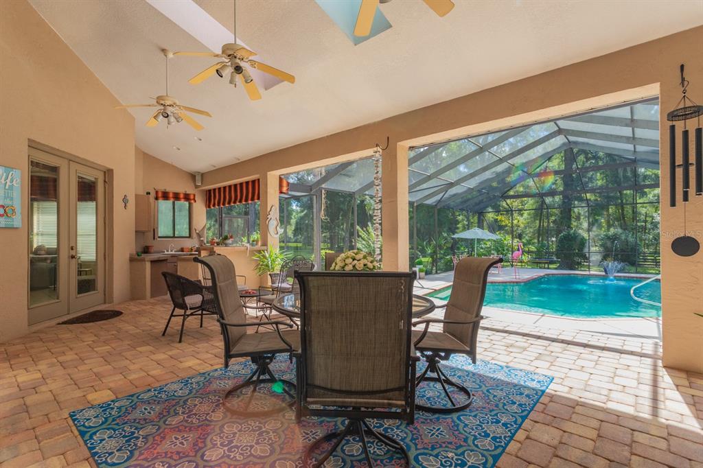 1640 Southeast 91st Place Ocala, FL 34480 - Photo 45 of 66 a view of a dining room with furniture window and wooden floor