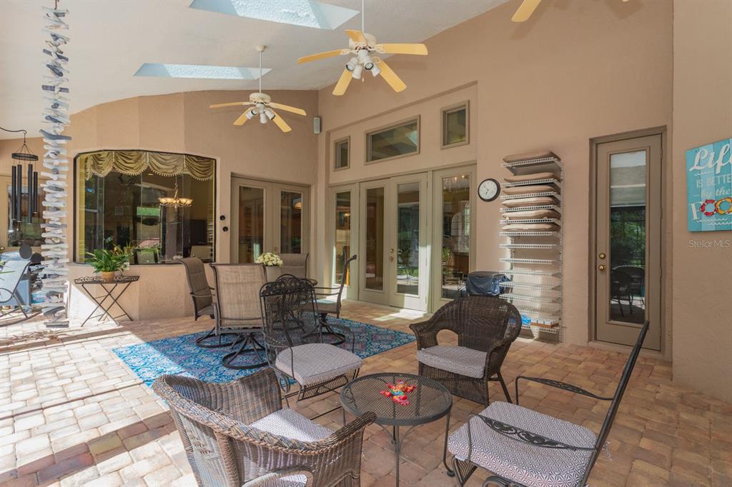 1640 Southeast 91st Place Ocala, FL 34480 - Photo 46 of 66 a living room with furniture dining table and a large window