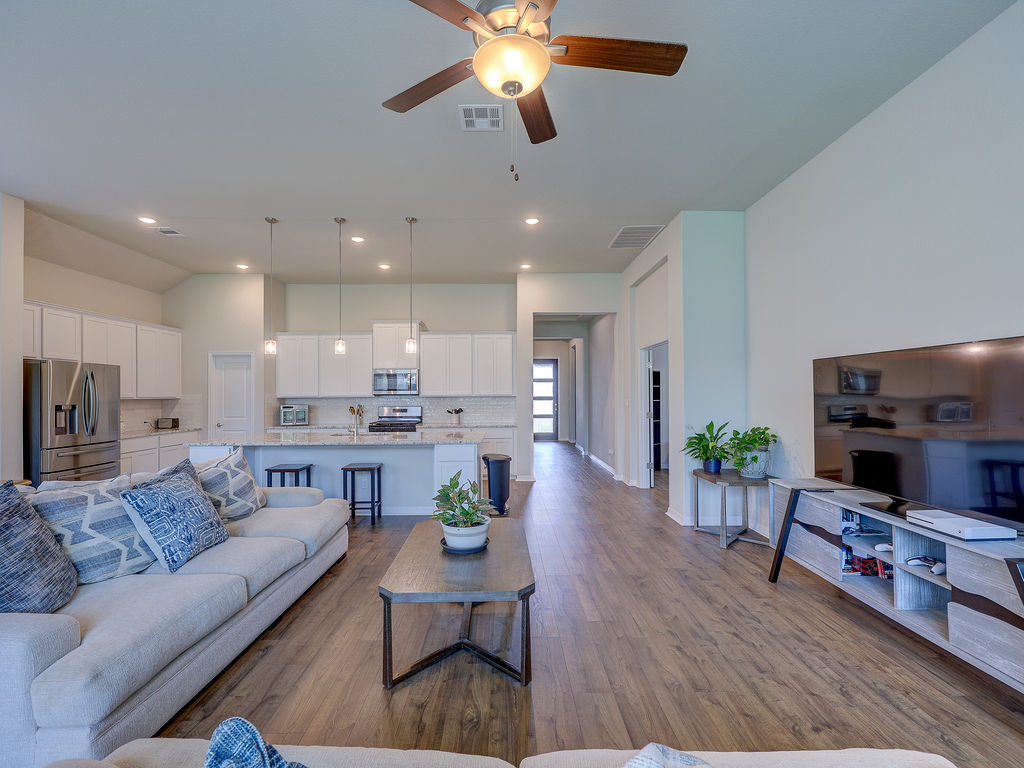 229 Heartleaf Road San Marcos, TX 78666 - Photo 40 of 40 An open floorplan seamlessly connects the well-appointed kitchen with the inviting living area.