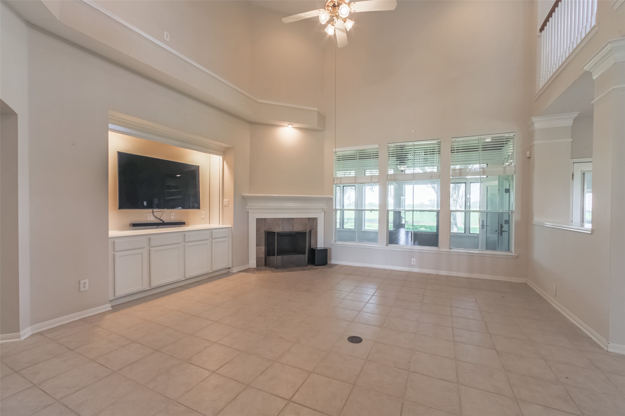 4903 Bowser Road Fulshear, TX 77441 - Photo 11 of 50 View of Family room with fireplace, TV niche and soaring ceilings