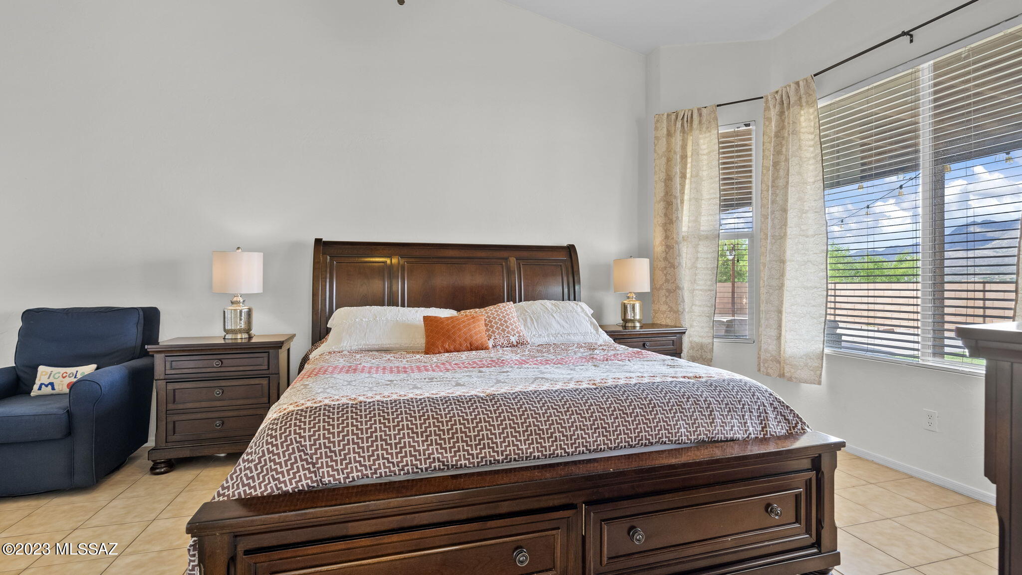 401 Via Capri Rio Rico, AZ 85648 - Photo 26 of 38 a bedroom with a bed and wooden floor
