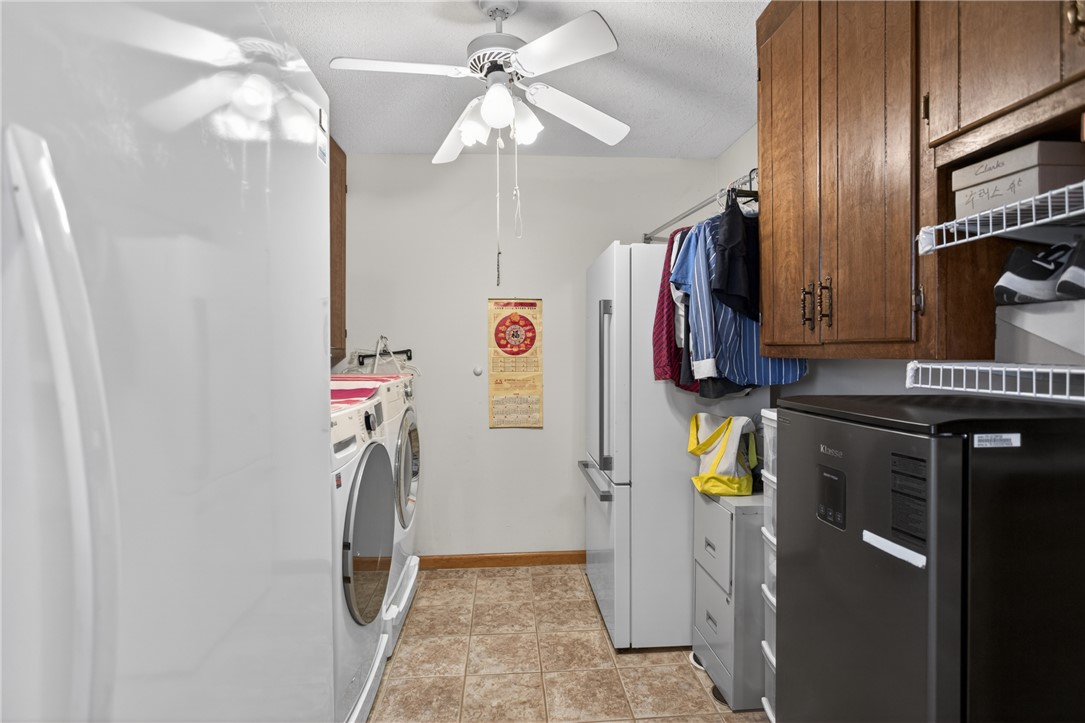 145 State Rd S-4-935 Pendleton, SC 29670 - Photo 23 of 47 Functional utility space with durable tile flooring and convenient laundry appliances.