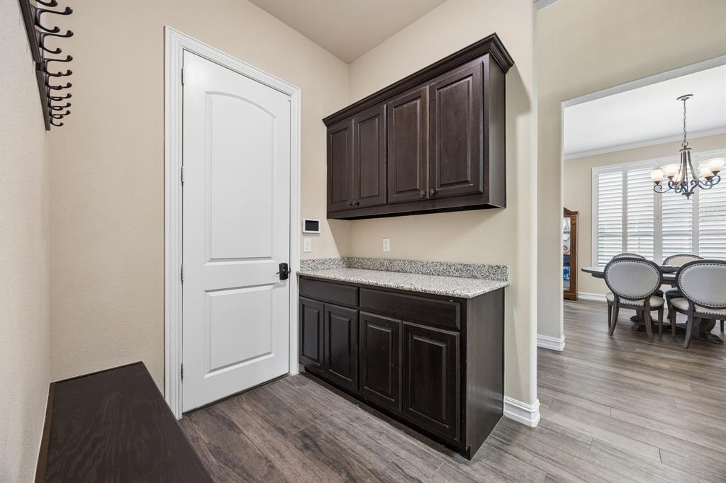 948 Holt Lane Allen, TX 75013 - Photo 29 of 40 Built in shelves at entrance from garage for more storage