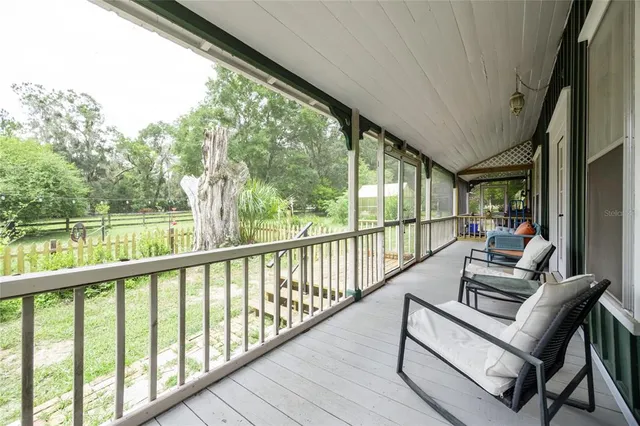 a view of balcony with couch and wooden floor