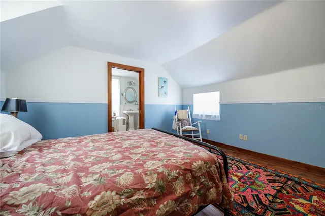a spacious bathroom with a bathtub a sink and a mirror
