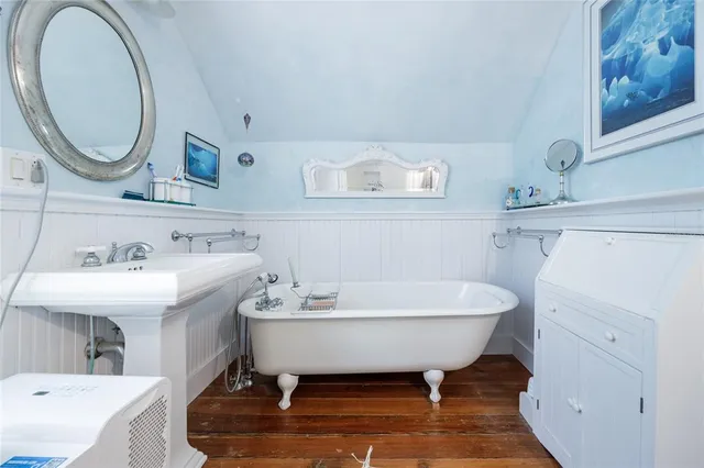 a view of room with furniture and wooden floor