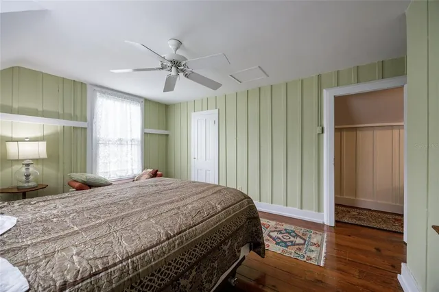 a kitchen with a refrigerator and a stove top oven