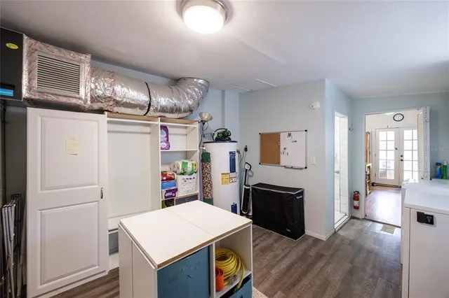 a view of green field with trees in the background