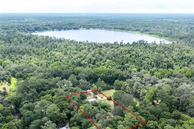 a view of a lake with a yard