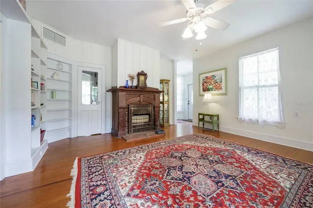 a living room with furniture and a fireplace