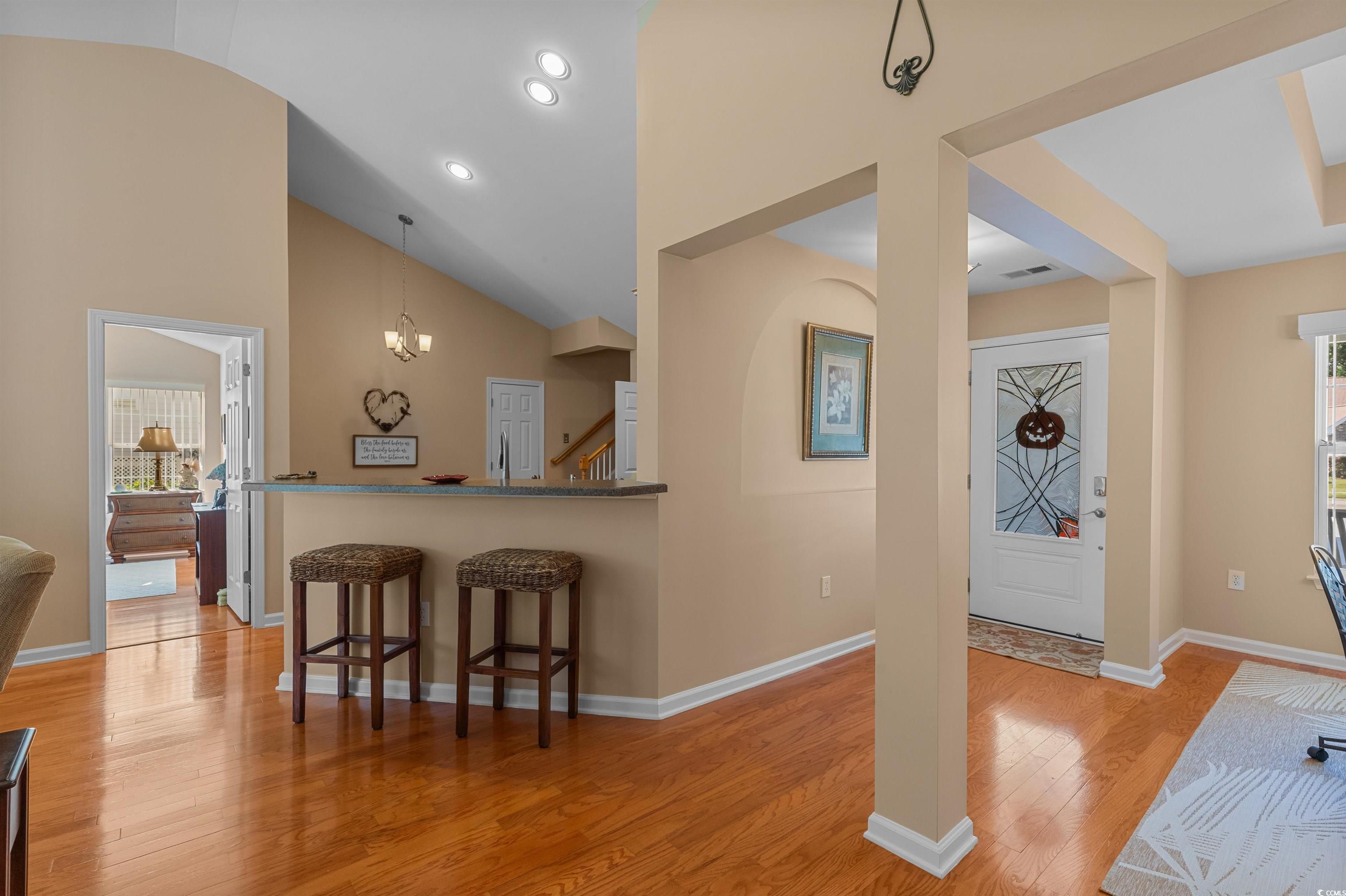 3505 Arrowhead Boulevard Myrtle Beach, SC 29579 - Photo 5 of 40 Entrance foyer with lofted ceiling, light wood-style floors, a chandelier, and recessed lighting