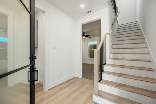 a view of entryway with wooden floor