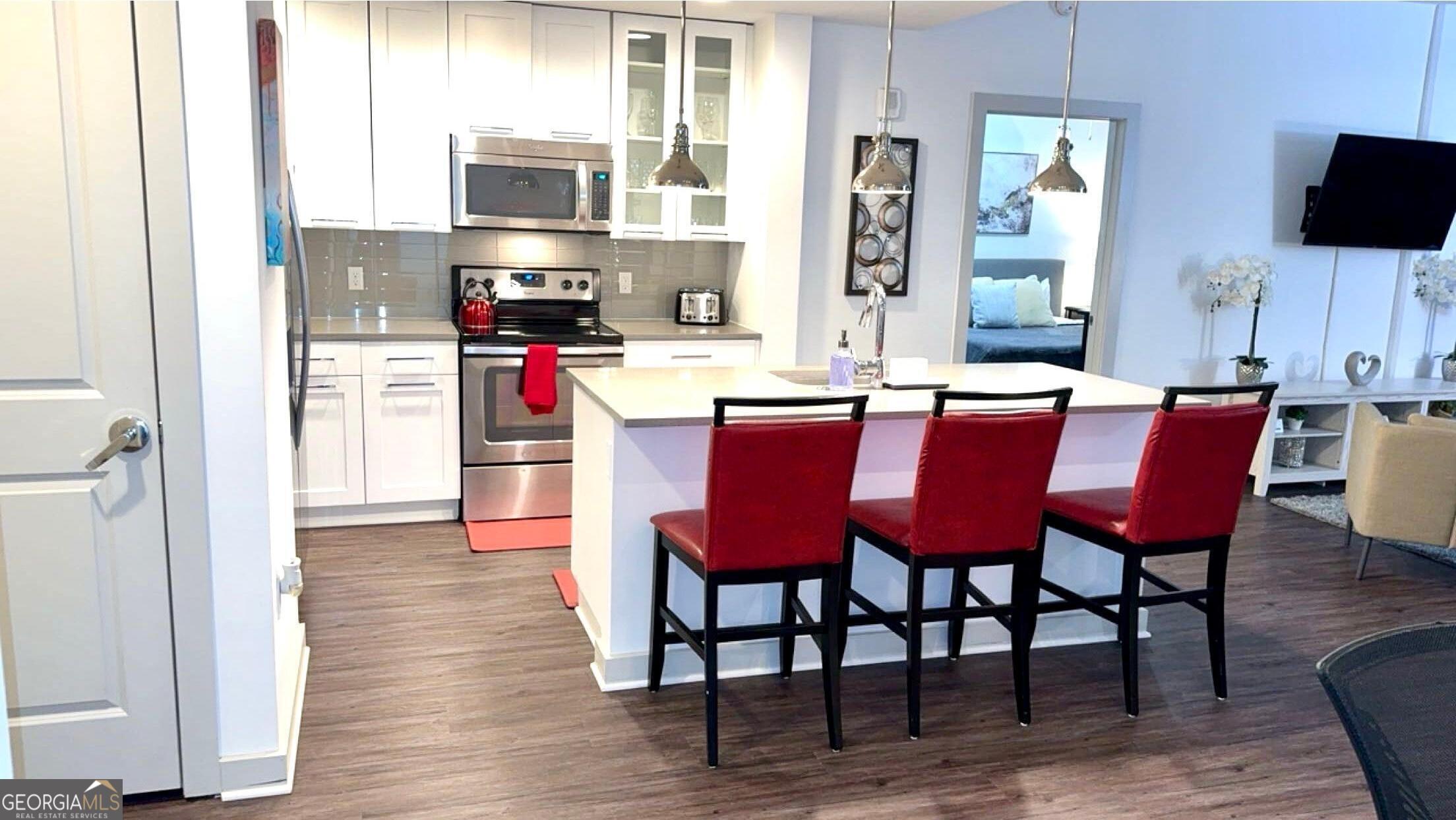 3382 Peachtree Road, Unit S12 Atlanta, GA 30326 - Photo 12 of 47 a dining room with a wooden table and chairs