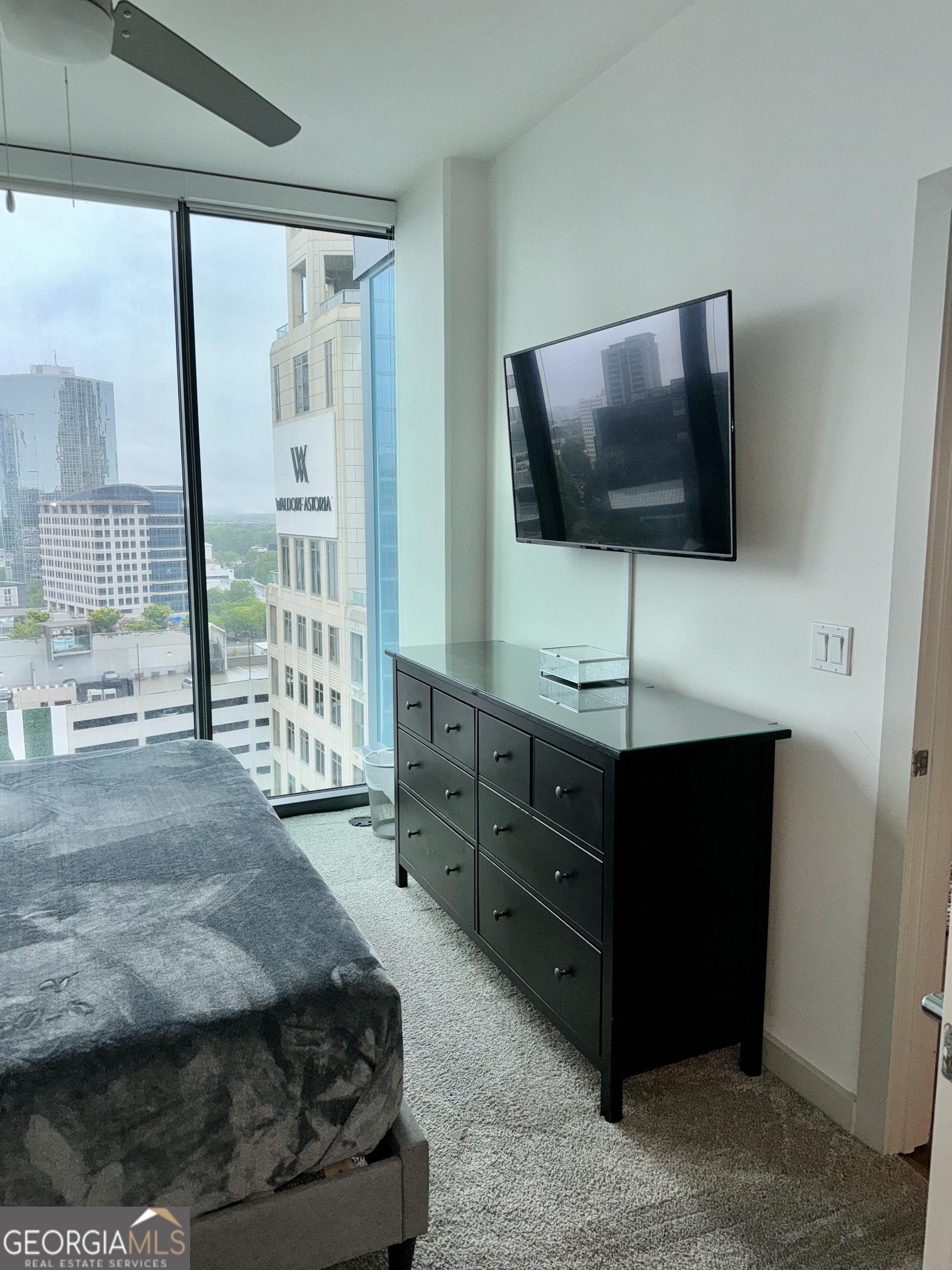3382 Peachtree Road, Unit S12 Atlanta, GA 30326 - Photo 15 of 47 a living room with furniture and a flat screen tv