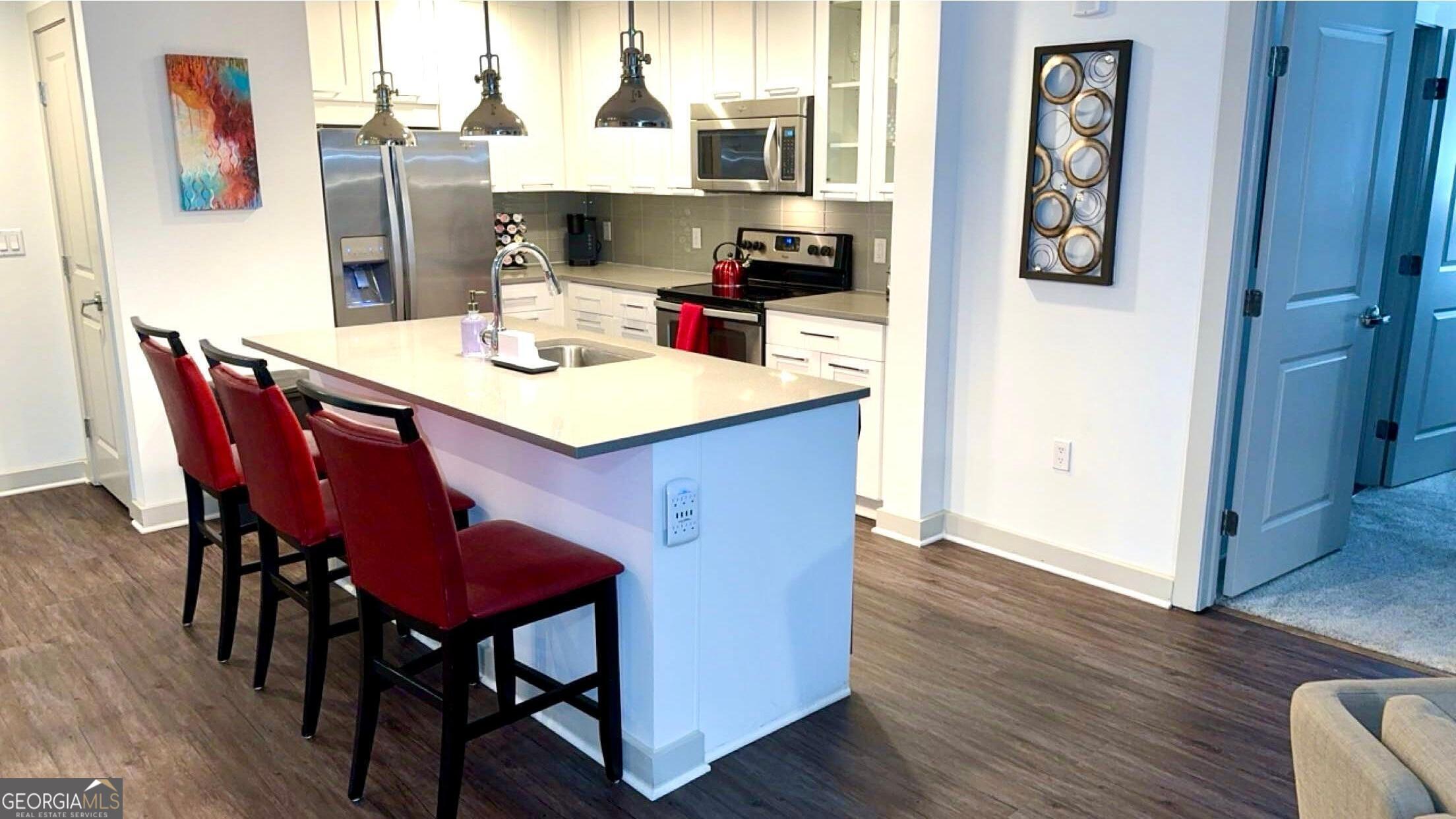 3382 Peachtree Road, Unit S12 Atlanta, GA 30326 - Photo 18 of 47 a view of a dining room with furniture and wooden floor
