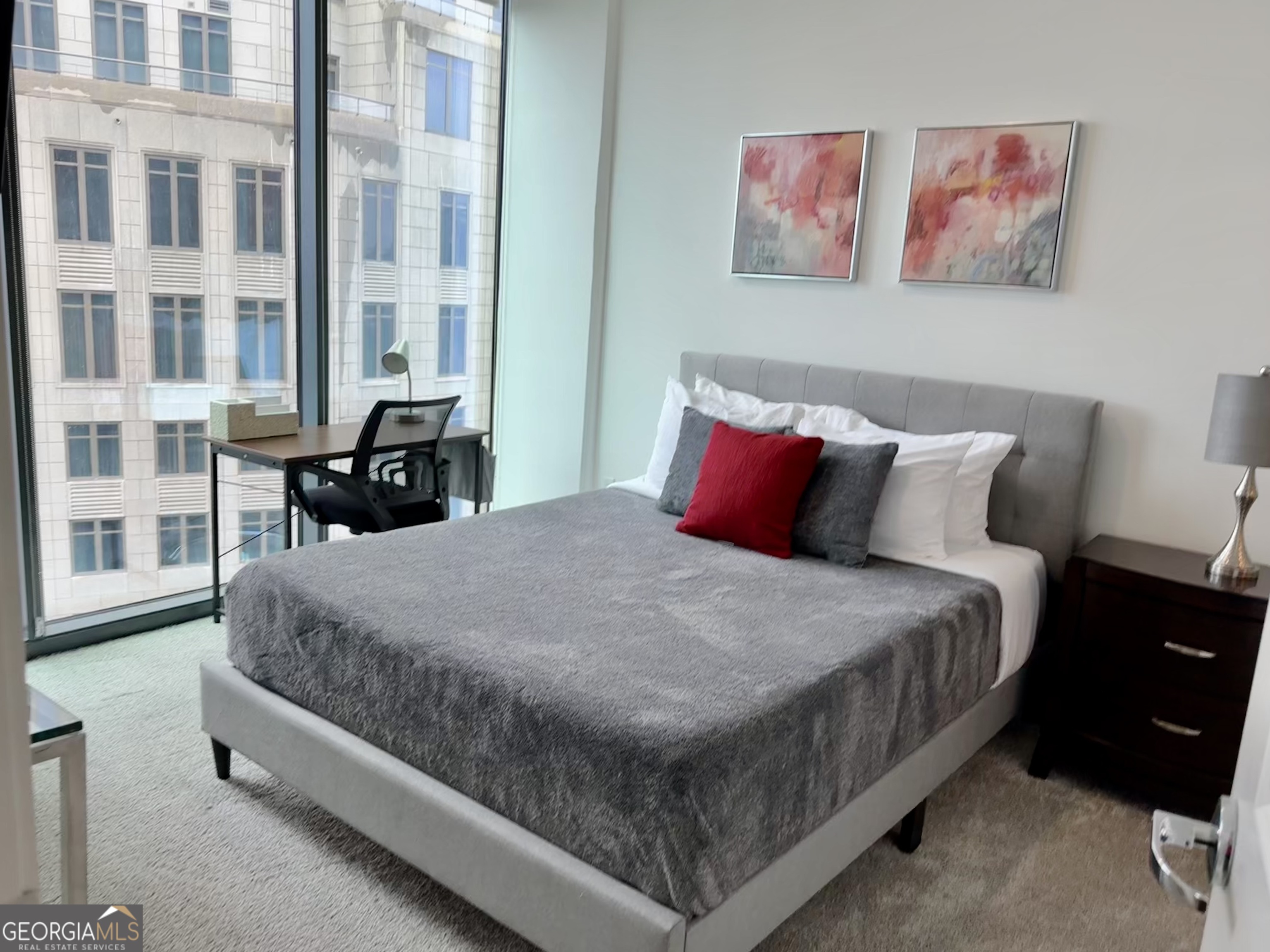 3382 Peachtree Road, Unit S12 Atlanta, GA 30326 - Photo 21 of 47 a bed sitting in a bedroom next to a large window