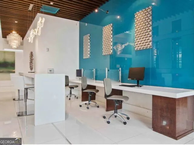 a work place with a desk chair and piano