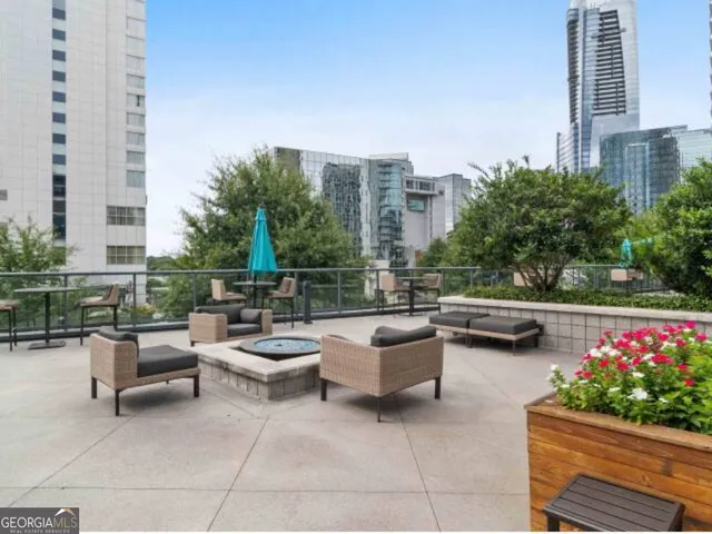 a view of a patio with couches and a potted plant