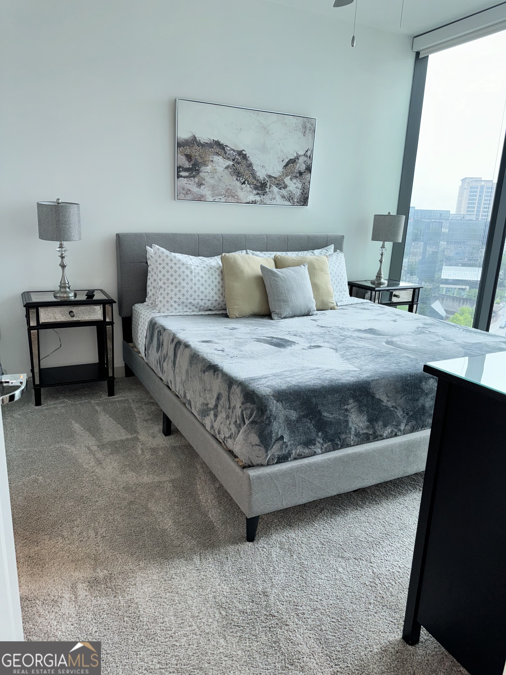 3382 Peachtree Road, Unit S12 Atlanta, GA 30326 - Photo 4 of 47 a bedroom with a bed and a mirror