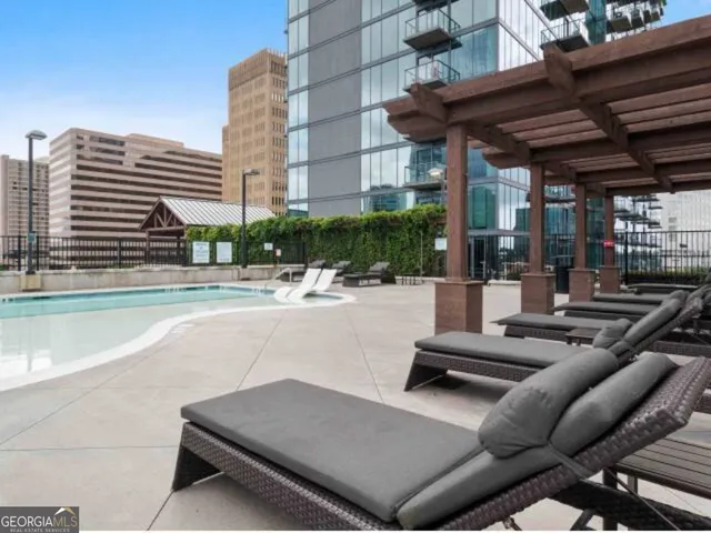 a view of a patio with a table and chairs