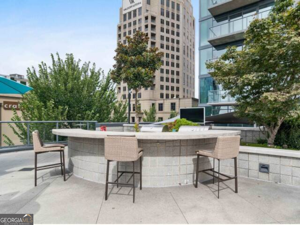 3382 Peachtree Road, Unit S12 Atlanta, GA 30326 - Photo 42 of 47 a view of a patio with a table and chairs