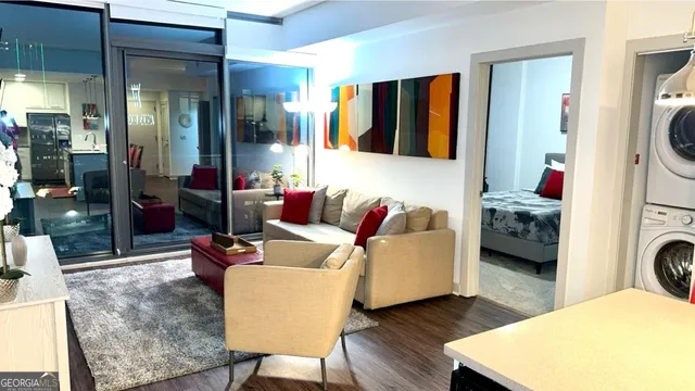 a living room with furniture and a lamp