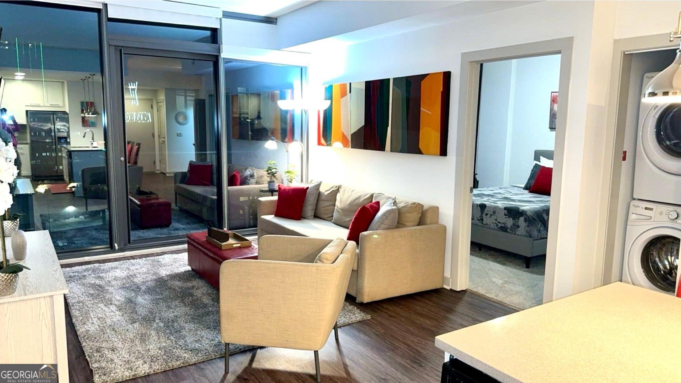 3382 Peachtree Road, Unit S12 Atlanta, GA 30326 - Photo 7 of 47 a living room with furniture and a lamp