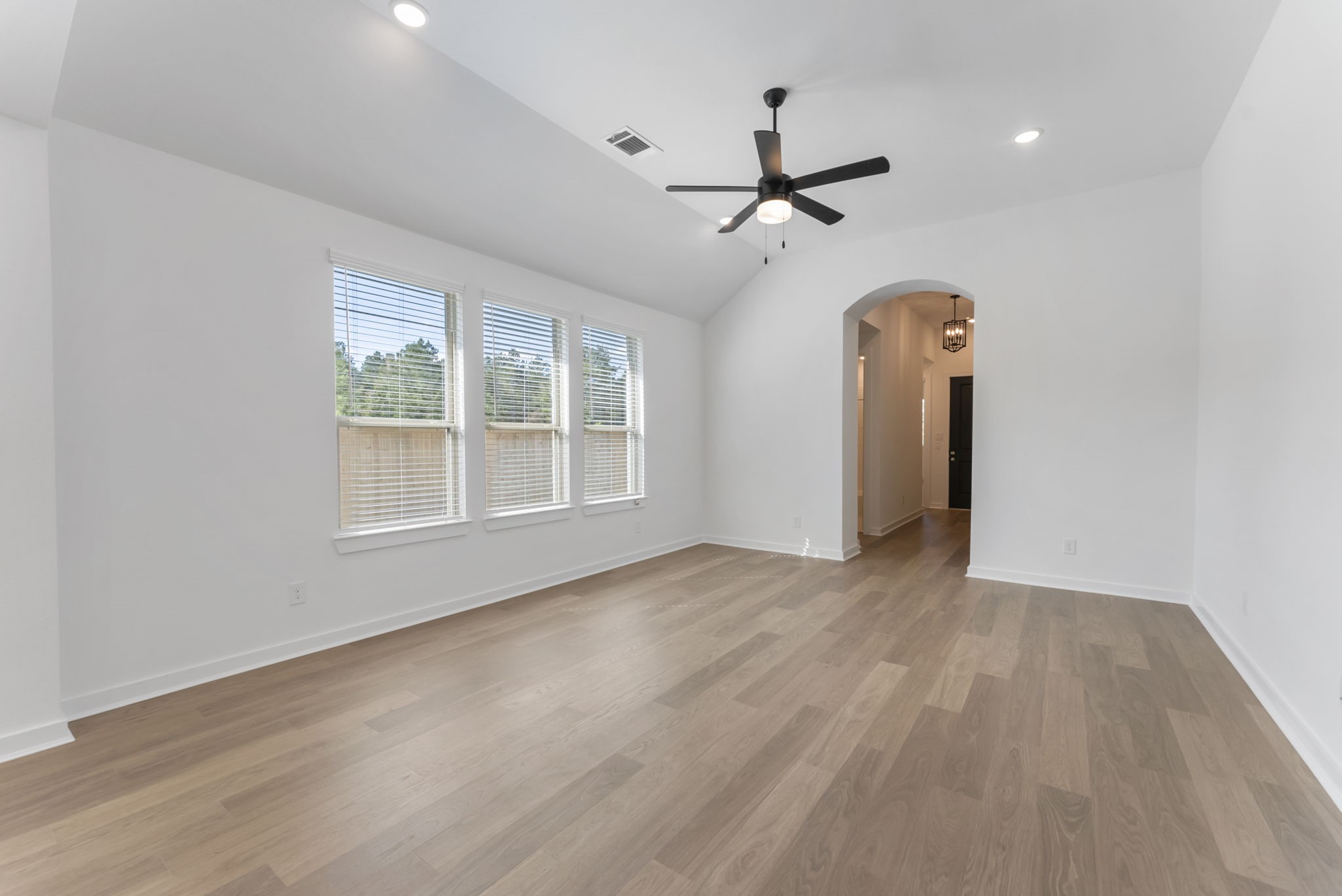 26383 Golden Pass Loop Montgomery, TX 77316 - Photo 11 of 43 a view of empty room with wooden floor and fan