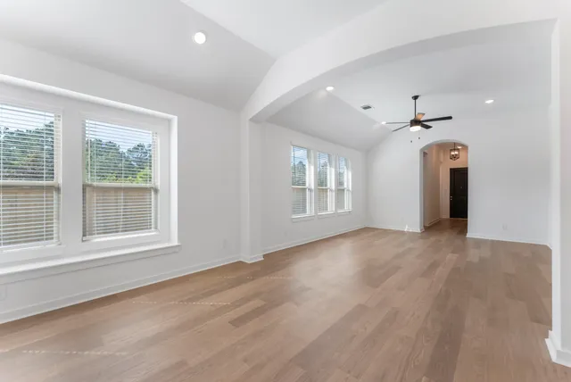 a view of an empty room with a window
