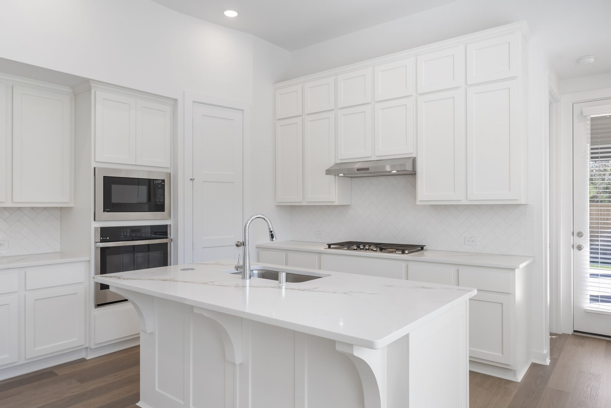 26383 Golden Pass Loop Montgomery, TX 77316 - Photo 19 of 43 a kitchen with stainless steel appliances a sink and cabinets