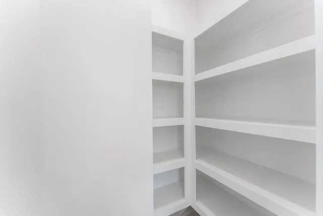 a kitchen with a sink stove and refrigerator