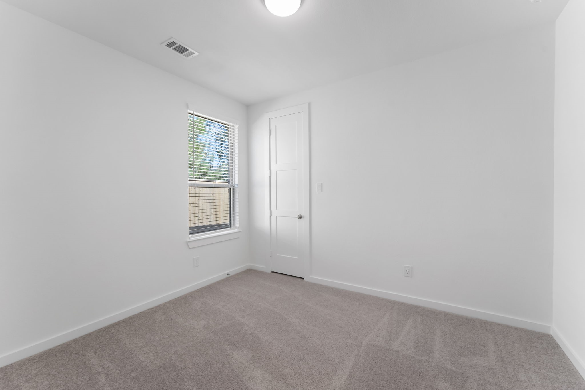 26383 Golden Pass Loop Montgomery, TX 77316 - Photo 25 of 43 an empty room with windows