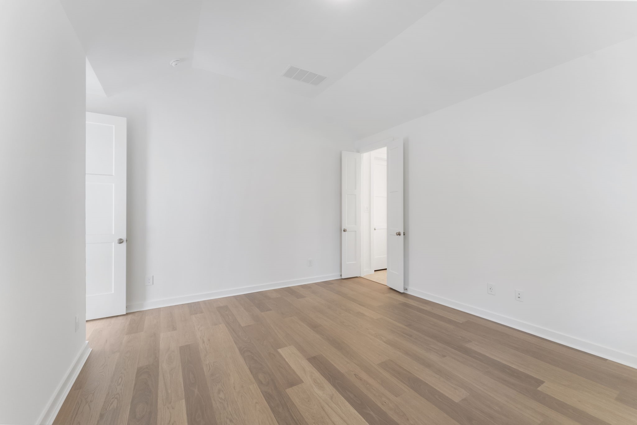 26383 Golden Pass Loop Montgomery, TX 77316 - Photo 28 of 43 a view of an empty room and wooden floor