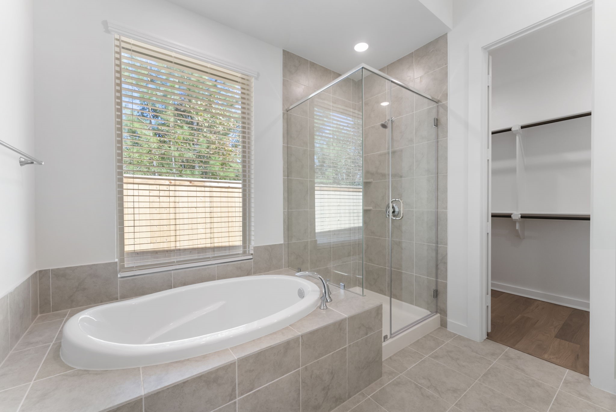 26383 Golden Pass Loop Montgomery, TX 77316 - Photo 32 of 43 a white bath tub sitting in a bathroom and shower