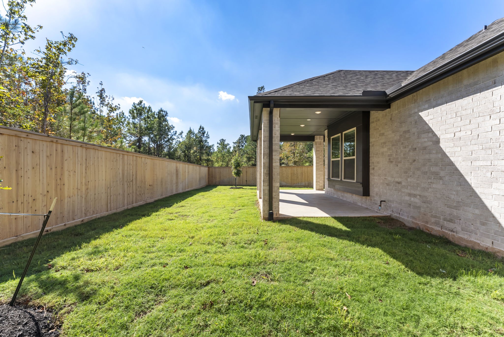 26383 Golden Pass Loop Montgomery, TX 77316 - Photo 42 of 43 a view of a house with backyard and sitting area