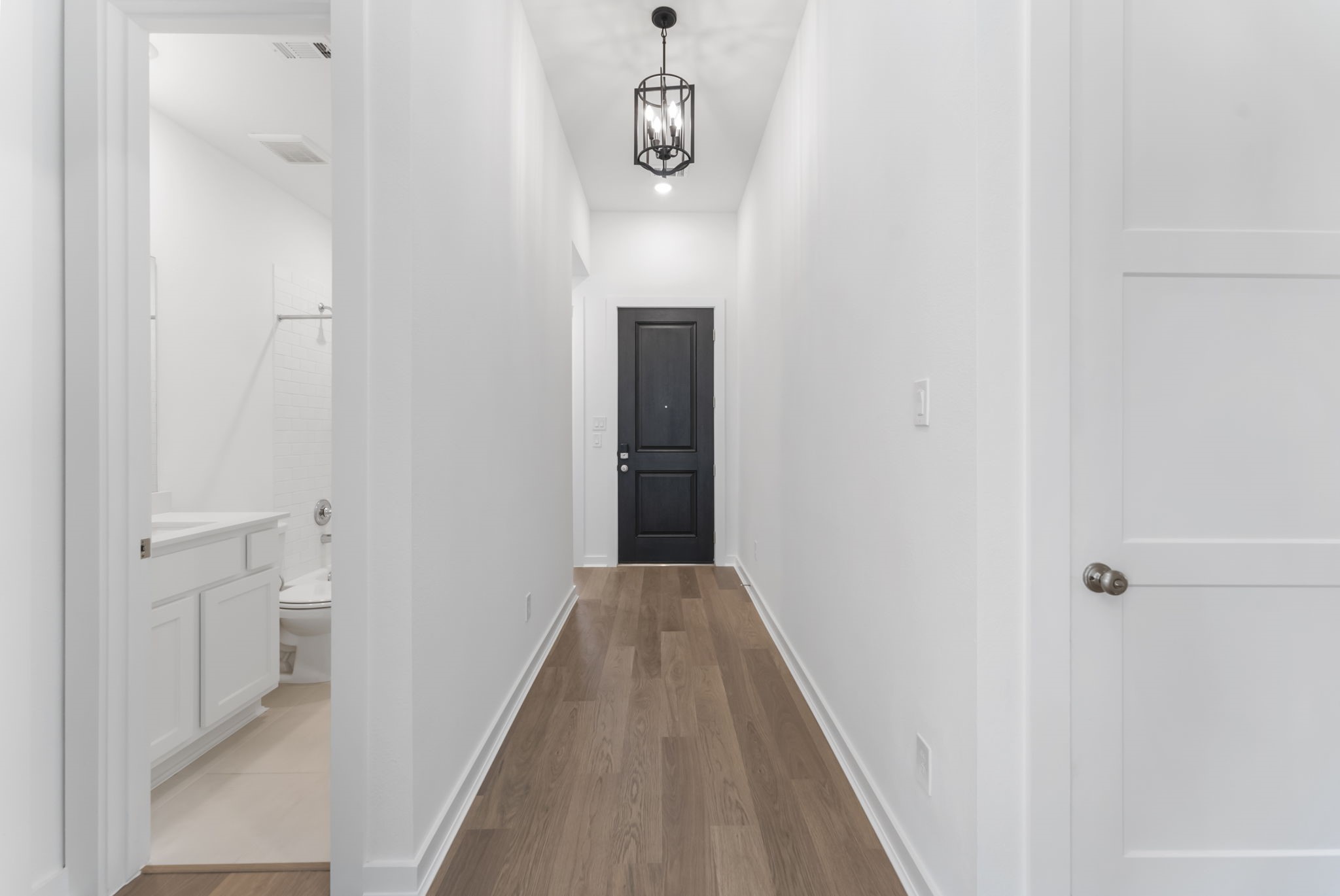26383 Golden Pass Loop Montgomery, TX 77316 - Photo 5 of 43 a view of a hallway with wooden floor and staircase