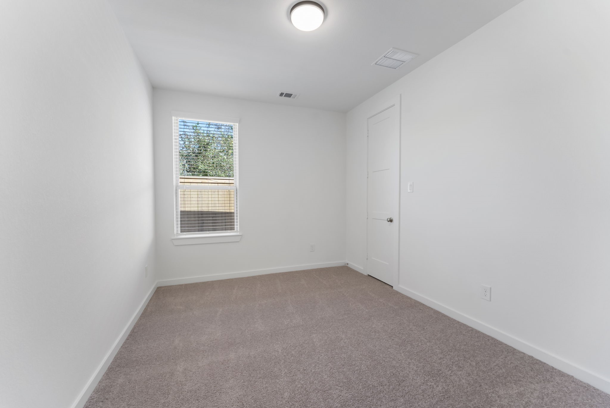 26383 Golden Pass Loop Montgomery, TX 77316 - Photo 7 of 43 a view of an empty room with a window