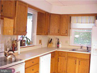 551 Kenmore Road Havertown, PA 19083 - Photo 2 of 6 a kitchen with a sink cabinets and window