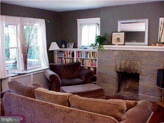 551 Kenmore Road Havertown, PA 19083 - Photo 3 of 6 a living room with furniture and a fireplace