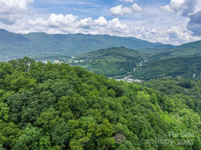 a view of mountain with mountains in the background