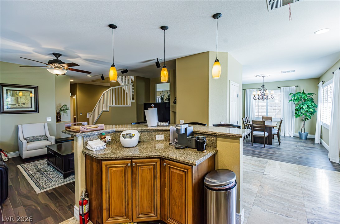 75 Tall Ruff Drive Las Vegas, NV 89148 - Photo 64 of 64 Gleaming stone countertops and warm wood flooring define this inviting open floorplan.